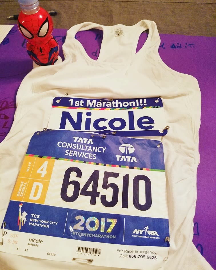 Nicole's bib for her first marathon, the 2017 NYC Marathon, pinned to her running top