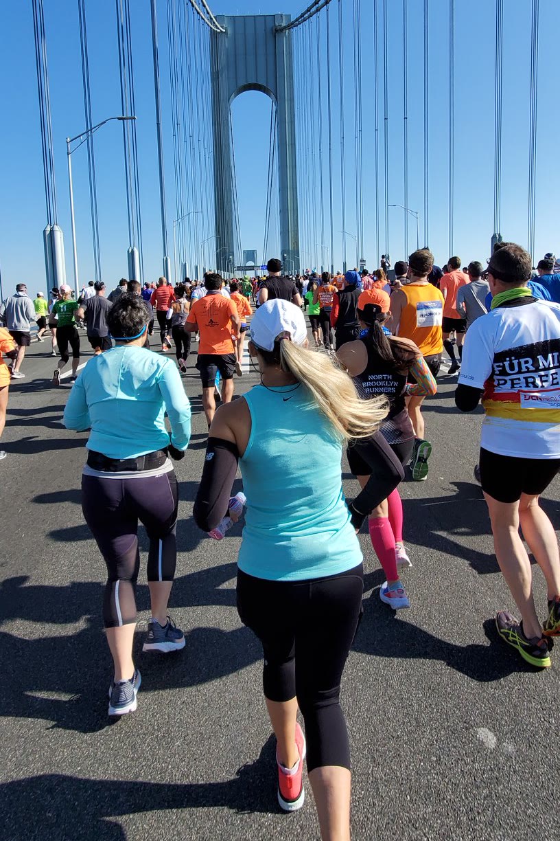 Nicole running across the Verrazzano Bridge at the start of the NYC Marathon