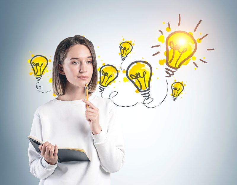 Woman thinking with lightbulbs