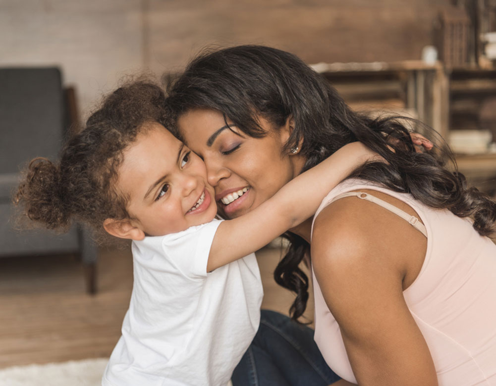 Girl hugging mom