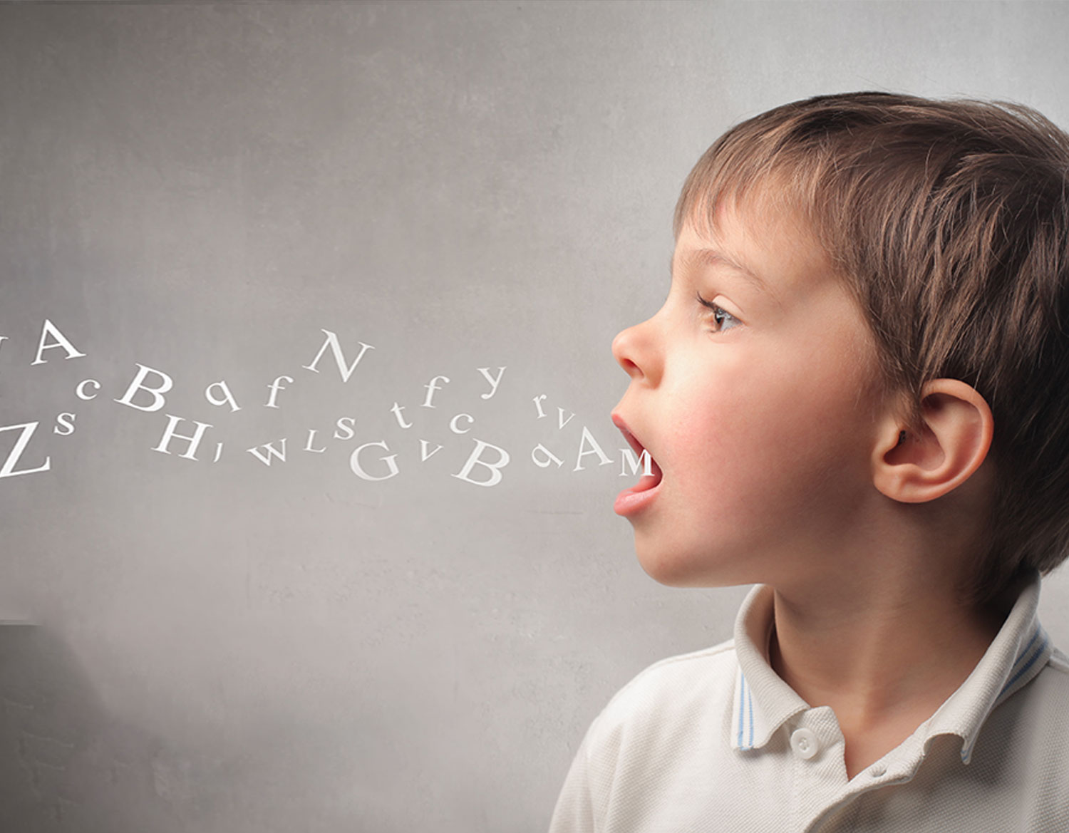 Boy with letters coming out of his mouth